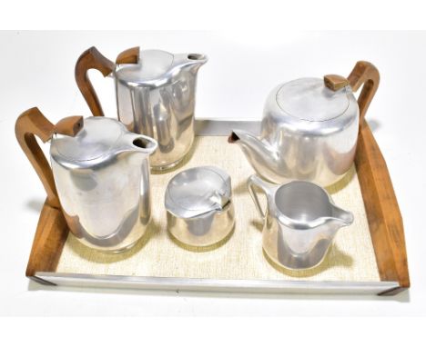 PICQUOT WARE; a six piece stainless steel tea and coffee service.Additional InformationMarks to the wood handles on the teapo