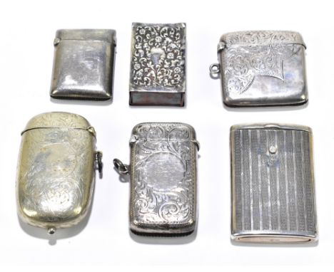 Four silver vesta cases including a sterling silver example with engine turned linear decoration, also a silver plated vesta/