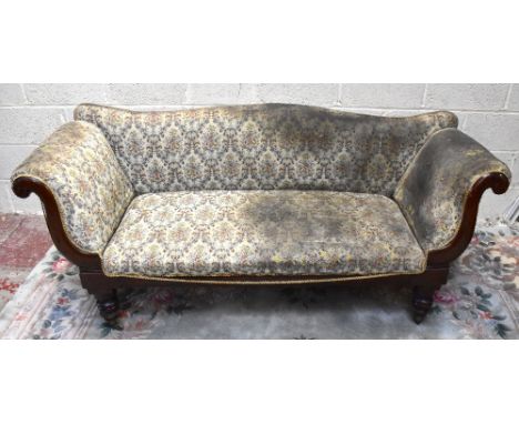 A 19th century rosewood framed sofa, upholstered in a floral material, raised on brass castors, width 164cm. 