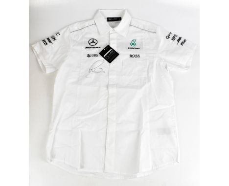 LEWIS HAMILTON; a Mercedes AMG F1 shirt, signed to the front, size S.Additional InformationCreasing and light general, no cer