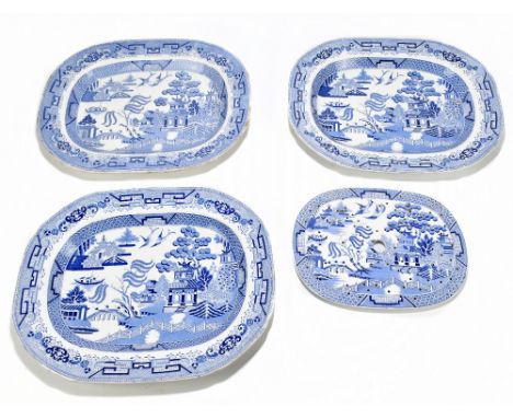 Three 19th century ironstone meat plates decorated in the 'Willow' pattern, together with a similar meat drainer (4).Addition