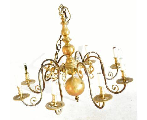 A Dutch style brass ceiling light with scrolling branches.