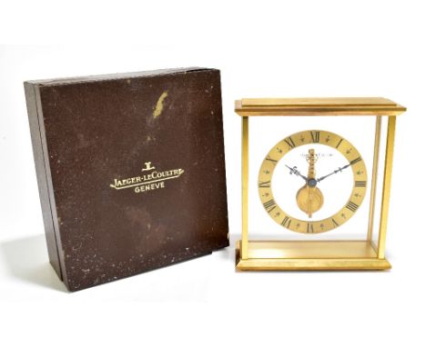JAEGER-LE-COULTRE; a gilt metal cased mantel clock with sixteen jewel movement, height 17cm, complete with box and warranty c