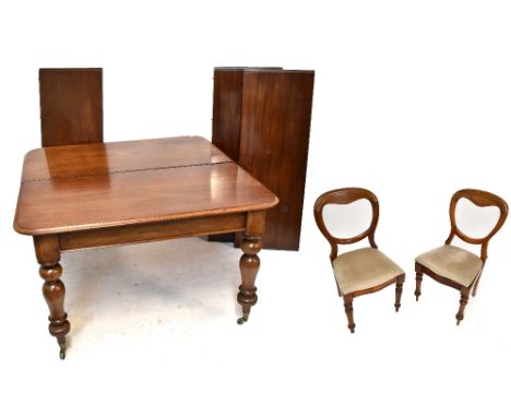 A Victorian mahogany pull-out extending dining table, raised on baluster form columns, overall length 155cm, together with a 