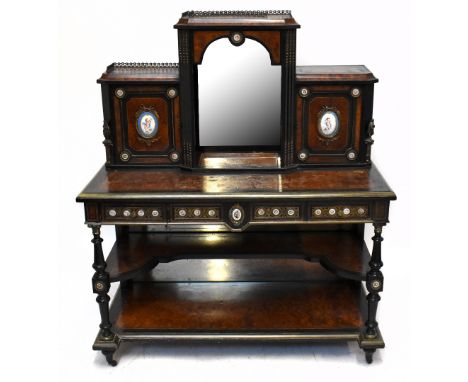 A late Victorian amboyna veneered ebony gilt metal and porcelain mounted bonheur de jour, the central raised section with mir