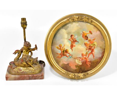 A gilt bronzed figural table lamp modelled as a cherub riding a swan, raised on alabaster plinth base, overall height 33cm, t