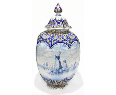 An early 20th century Delft faience ware octagonal jar and cover decorated with sailing vessels and floral sprays, indistinct
