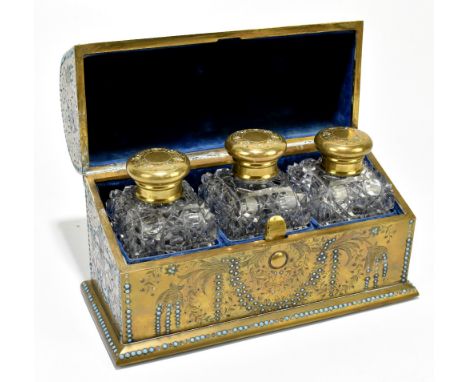 A fine late 19th century brass domed jewel decorated box enclosing three hobnail cut glass scent bottles with similarly jewel