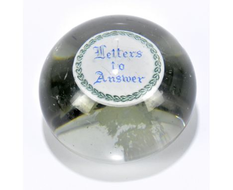 A Victorian glass paperweight, the interior inset with a silvered disc titled 'Letters to Answer', width 7cm.Additional Infor