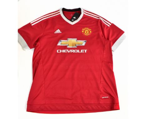 ERIC CANTONA; a 2015 Manchester United home shirt, signed to the reverse, size XL.Additional InformationCreasing and light ge
