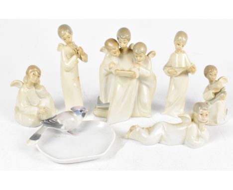 NAO; six assorted figures of angels including an example holding a tambourine, also a ceramic pin dish, with applied bird (7)