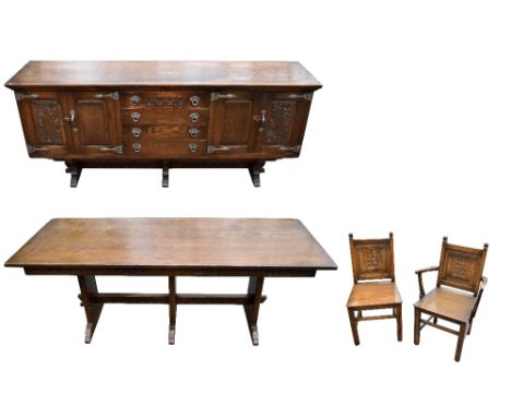 A reproduction of oak dining room suite comprising a refectory type table, eight panel backed chairs and a sideboard, length 