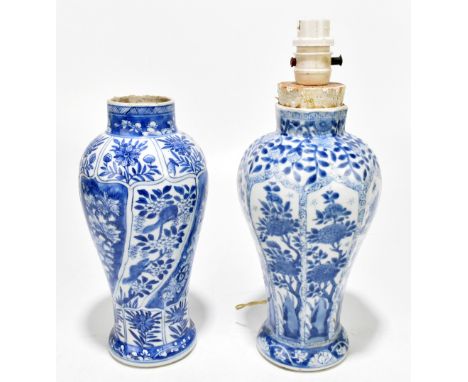 Two Chinese 19th century blue and white vases each converted to a table lamp, decorated with floral sprays, the cylindrical e