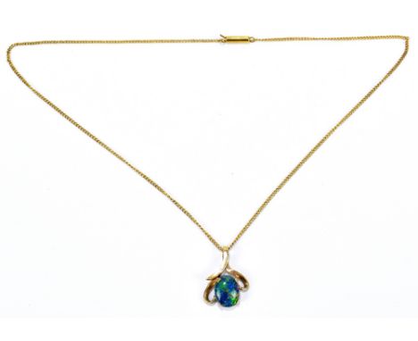 A 9ct yellow gold pendant set with a single triplet black opal, suspended on a yellow metal chain, approx 3.5g.