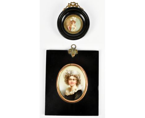 A late 19th century Continental porcelain oval plaque painted with the head and shoulders portrait of a young girl wearing a 