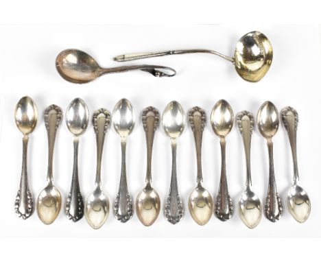 GEORG JENSEN; a sterling silver ladle in pattern no. XXI with planished decoration, together with twelve Georg Jensen fruit s