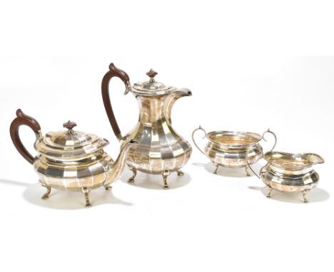 BARKER BROS LTD; a George V hallmarked silver four piece tea service, with panelled decoration, Sheffield 1927/8, approx weig