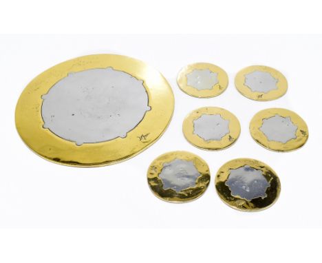 DAVID MARSHALL (born 1942); a brass and aluminium circular table stand and four similar circular coasters, each signed, the s