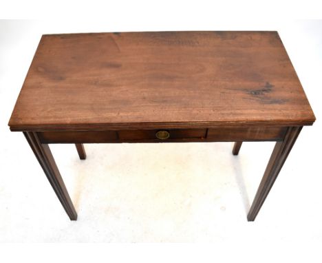 A George III mahogany fold over tea table with single drawer, raised on tapering block legs, width 90cm, depth 45cm, height 7