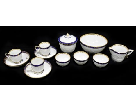 DERBY; a late 18th century twelve piece part service with relief moulded detail of swag and flowers inside blue and gilded ba