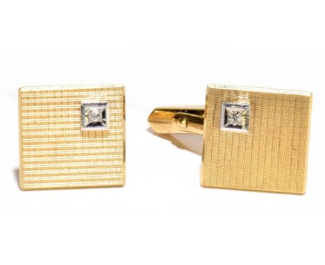 A pair of 9ct gold and diamond cufflinks of square form with engine turned decoration and diamond to the top left, approx. 9g