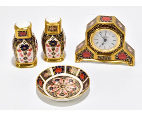 ROYAL CROWN DERBY; four pieces decorated in the old Imari 1128 pattern, including a mantel clock with hexagonal face, height 