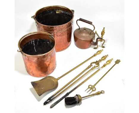 A small group of copper and brass comprising a cylindrical bucket, similar smaller example, copper kettle and various fire to