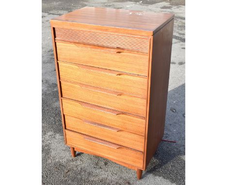 A mid-century teak pillar chest of six drawers. Provenance: from the estate of Stanley Dobbin.