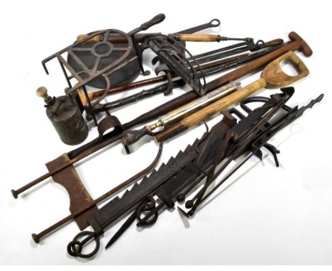 A large collection of 19th century and later metalware including garden sprayers, brass candlesticks, scales, also tools incl