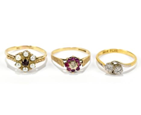 Two 9ct yellow gold dress rings including an example set with six sea pearls flanking a ruby coloured central stone, also an 