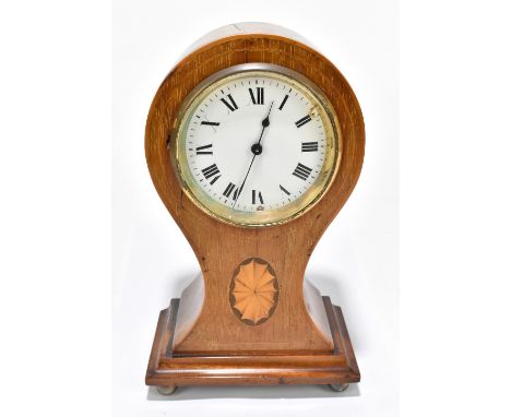 An Edwardian walnut balloon mantel clock with inlaid panel, the circular enamel dial set with Roman numerals, raised on four 
