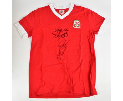 WALES; a short sleeve Wales football shirt, signed by Giggs, Bale, signed to the front.Additional InformationCreasing and lig