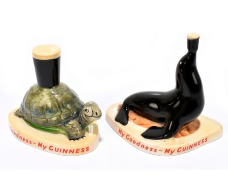 GUINNESS; two Carltonware figures comprising a seal holding a pint of Guinness and a tortoise supporting a pint of Guinness, 