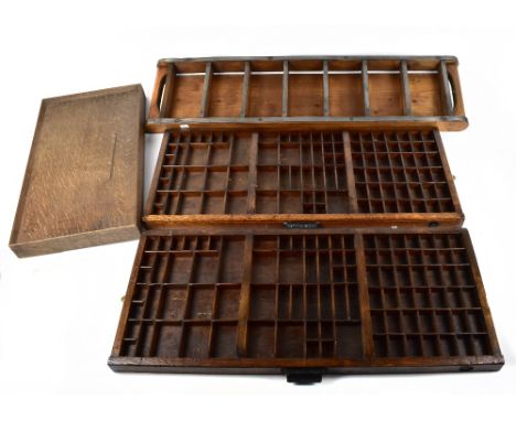 Two vintage oak display trays, the handles named 'John Haddon &amp; Co, London', together with a further hanging shelf and a 