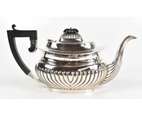 G H JAMES &amp; CO; a George V hallmarked silver teapot with gadrooned lower body, Birmingham 1925, approximate weight 20.27o