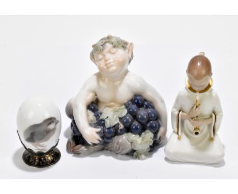 ROYAL COPENHAGEN; a figure of a Pan numbered 2361, height 13cm, together with a further Royal Copenhagen figure of a girl smo
