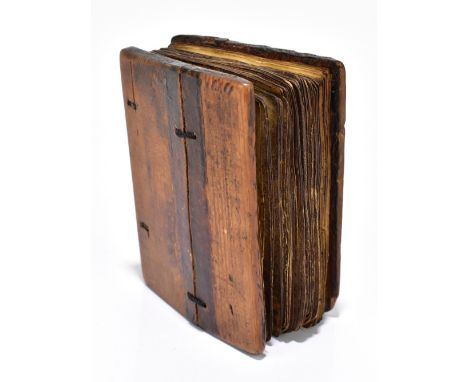 An Ethiopian hand written and decorated Coptic manuscript, the vellum pages with Ge'ez text and six pages decorated with sain