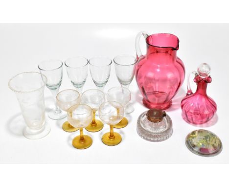 A collection of 19th century and later glassware including a cranberry jug with ribbed detail, various drinking glasses, a cl