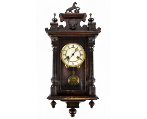 JUNGHANS; an early 20th century ebonised Vienna type wall clock with horse finial, the circular dial with Roman numerals, hei