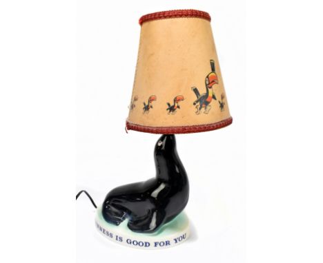 GUINNESS; an advertising Carltonware seal lamp with associated shade, overall height 33cm.Additional InformationAs stated, th