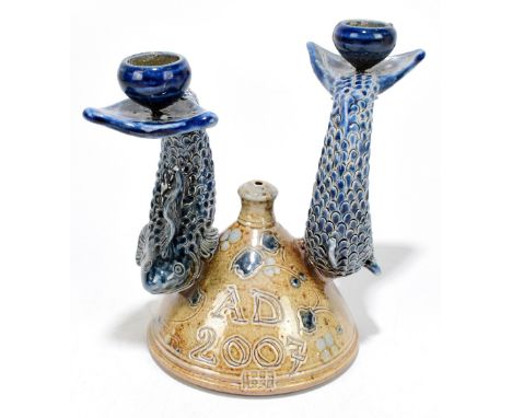 CONDERTON POTTERY; a glazed stoneware two branch candlestick, modelled as two fish upon an conical base, seal mark to the sid