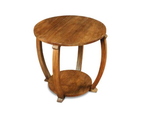 An Art Deco walnut occasional or lamp table, the circular veneered top raised on four bowed supports and circular underteer 4