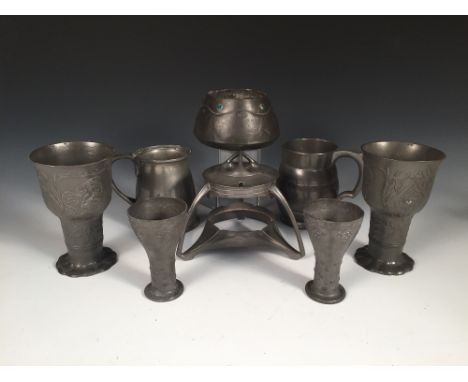 A small collection of Art Nouveau pewter wares, comprising a pair of continental goblets embossed with maidens, a small pair 