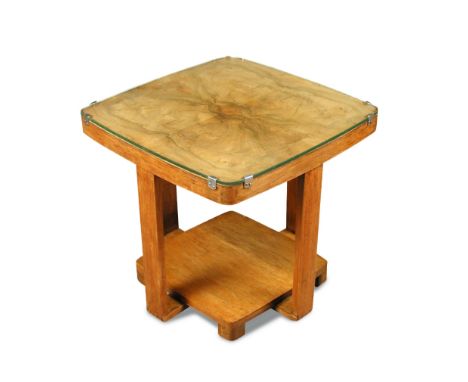 An Art Deco walnut occasional or lamp table, the quarter-veneered top raised on four supports with a straight grain underteer