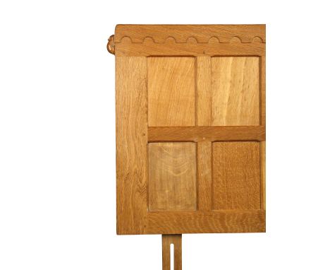 A modern Robert 'Mouseman' Thompson oak headboard, of panelled design with carved mouse signature 95 x 137½cm (37 x 53in)  