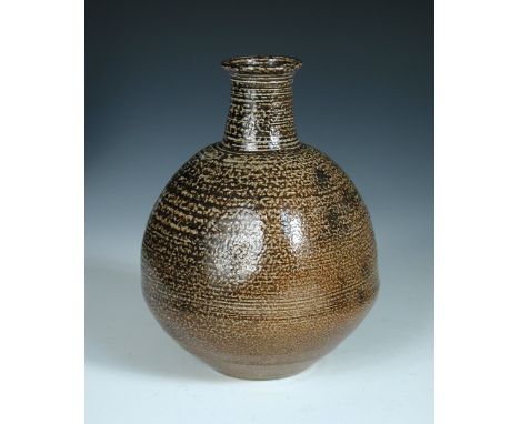 § William (Bill) Marshall, (British, 1923-2007), a rare salt glaze stoneware bottle vase, with mottled brown glaze, impressed