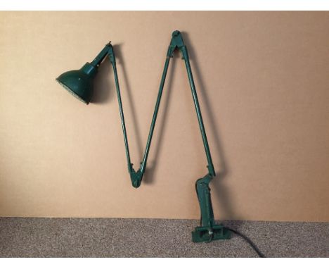 An industrial green painted angle poise lamp, with drilled rectangular mounting plate  