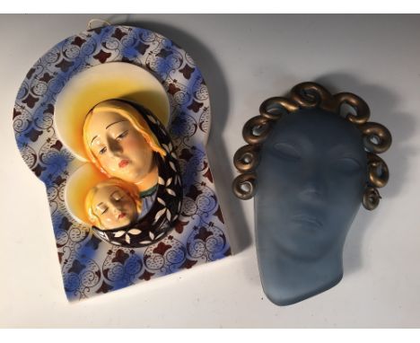 A Lenci style ceramic plaque of the Madonna and child, indistinct printed factory marks, together with a glass face mask in t