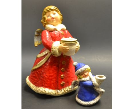 A large Geobel Hummel type figural candle stick, Krobek; another smaller (2)