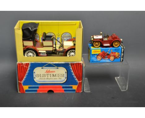 Schuco Clock Work Toys - a 1036/1 Micro Racer Mercer Typ 35 J 1913, red body work, with key;  a  maroon and cream 1229 Old Ti